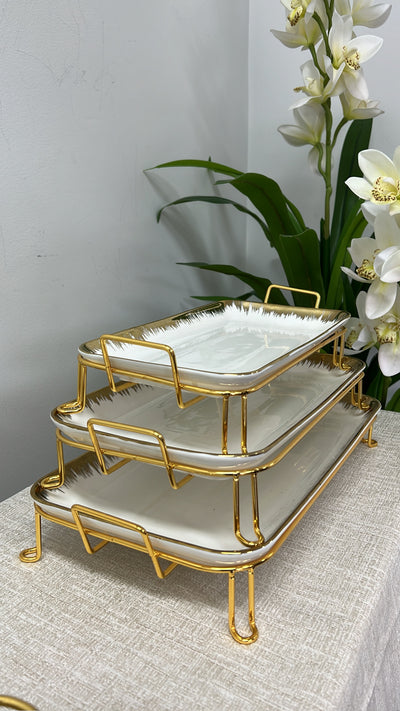 gold and white rectangular rack serving platter